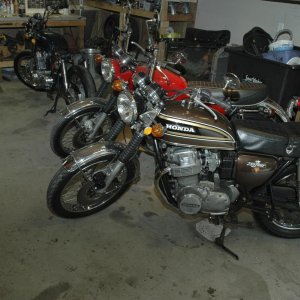 Three CB750's, a classic 1970 next to a '73 in front of a '73 soon to be cafe racer!